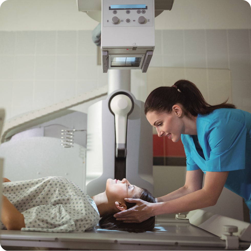 A Travel allied clinician readies a patient for a medical scan