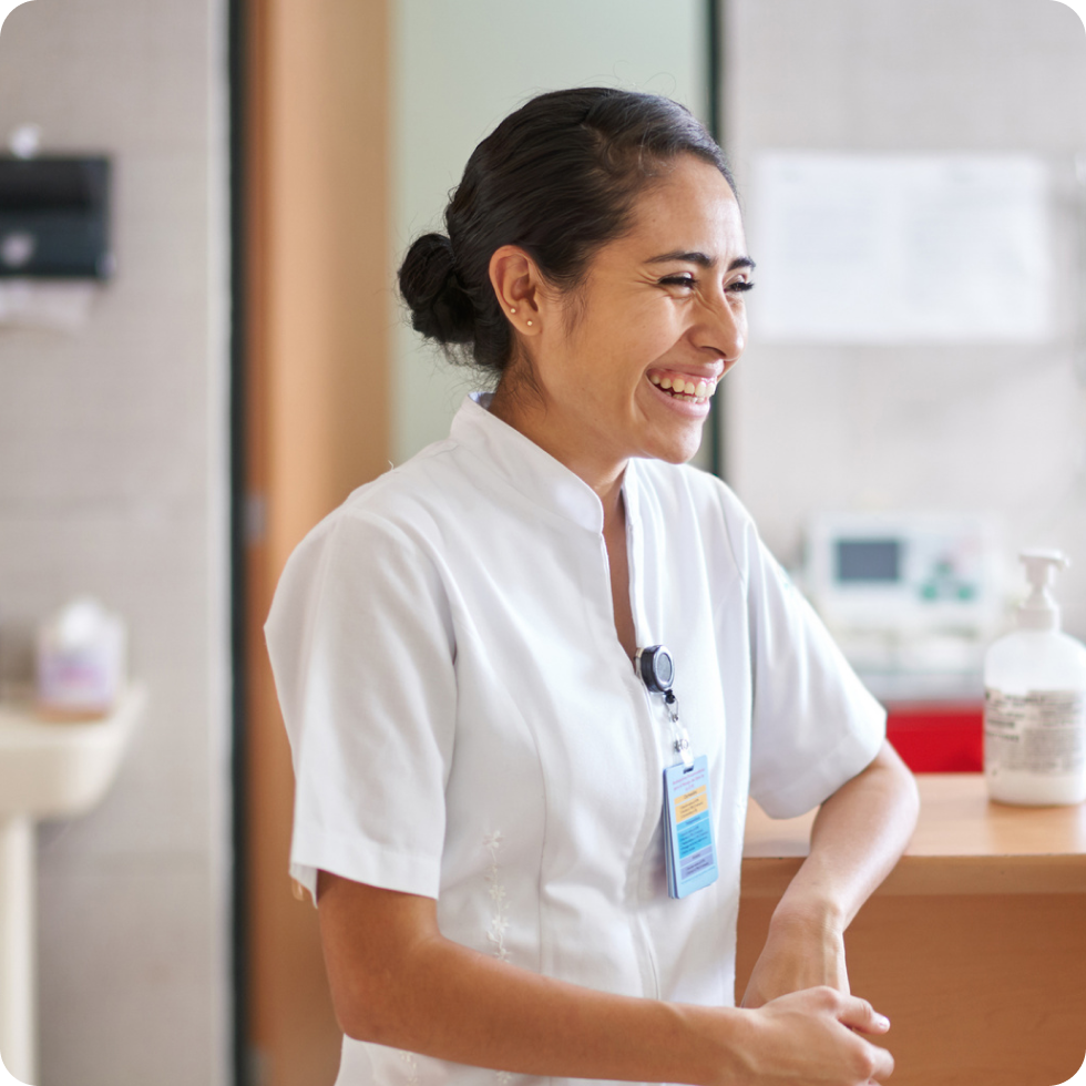 A smiling travel allied clinician