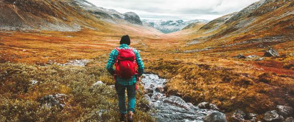 Person hiking through valley