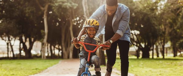 Man and child on a bike