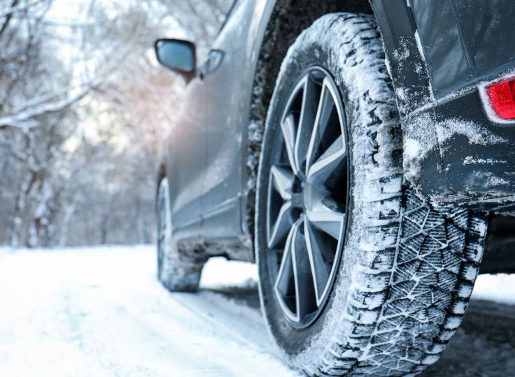 Car driving on snowy road