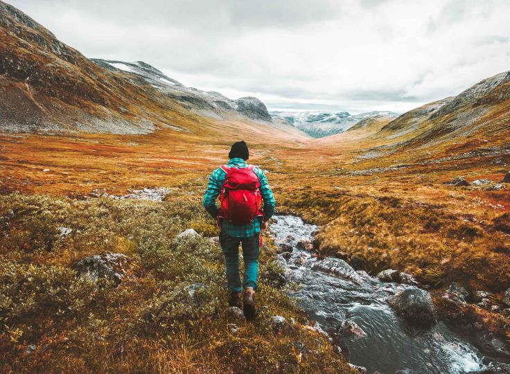 Person hiking through valley