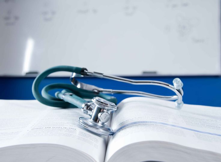 Stethoscope on nursing school book