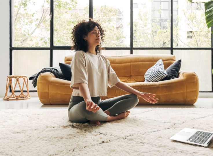 Woman meditating on the ground